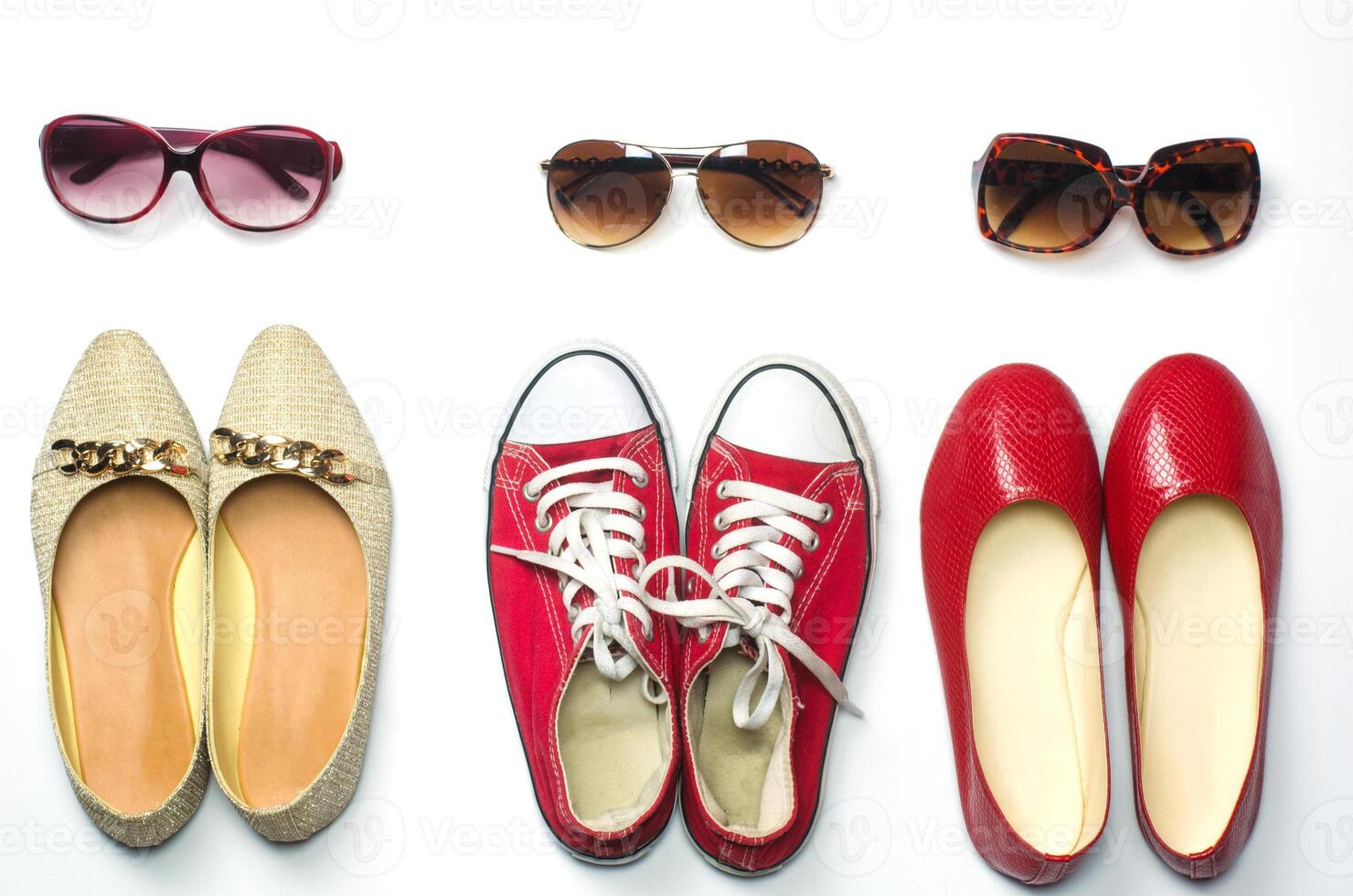 Placed shoes and sunglasses on a white background styles - lifestyles photo