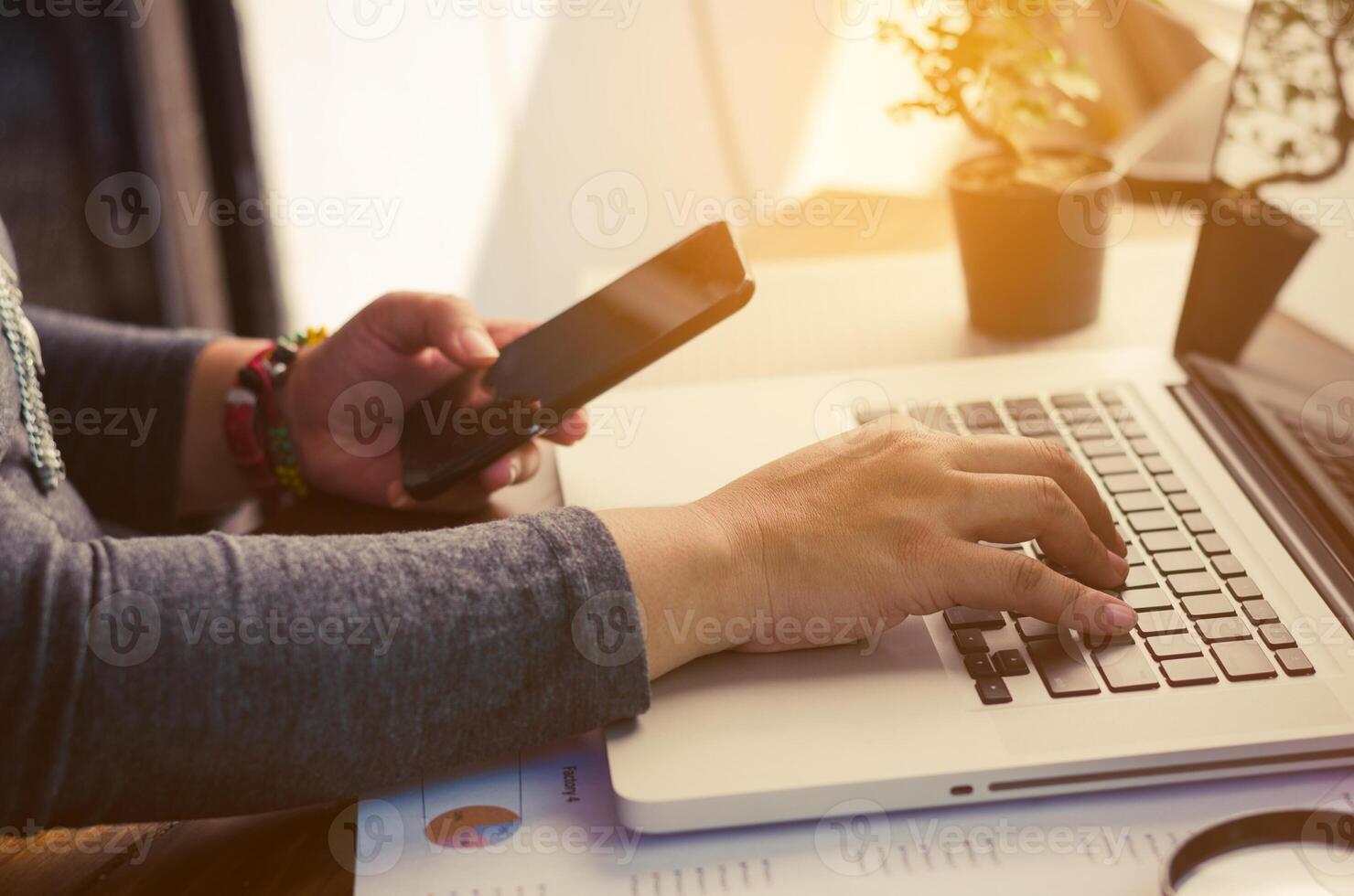 Businessman working on a desk numerical analysis, financial accounting. Graphing Calculator on laptop photo