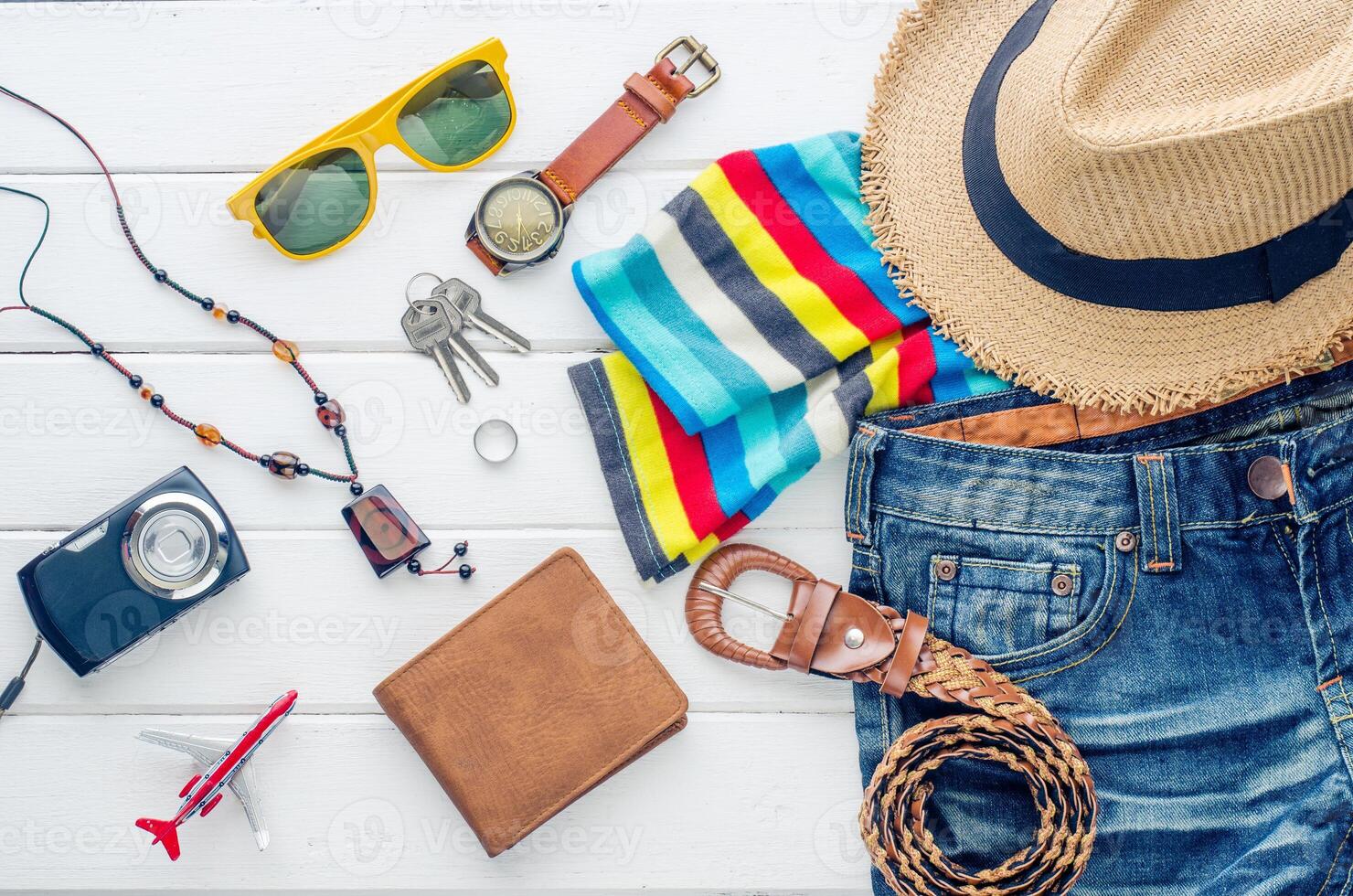Travel accessories and costume on white background photo