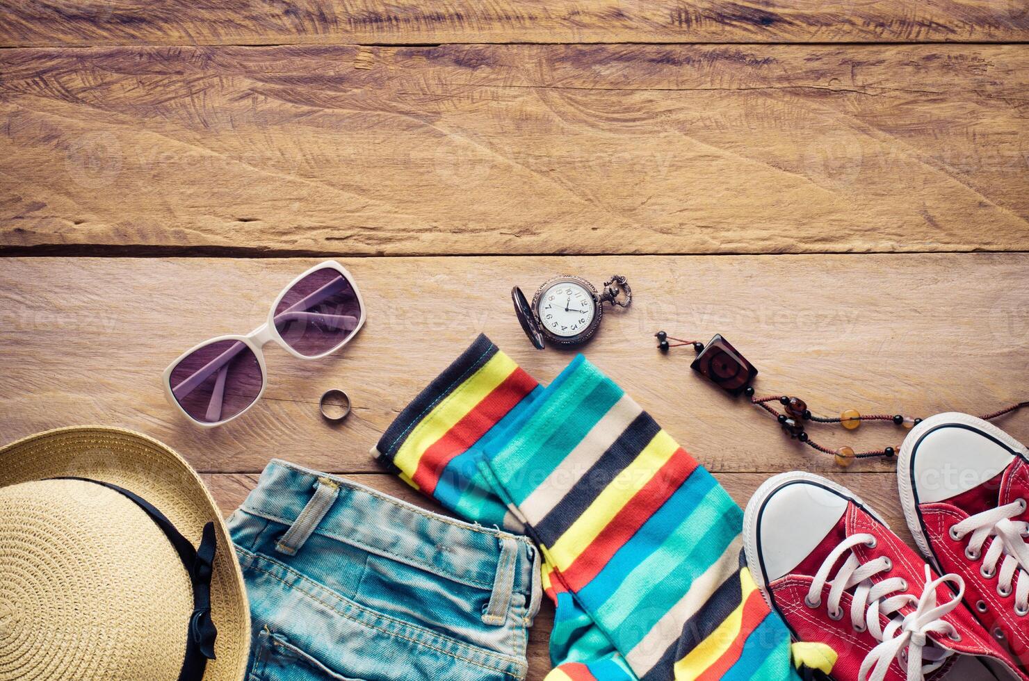 clothing for women, placed on a wooden floor. photo