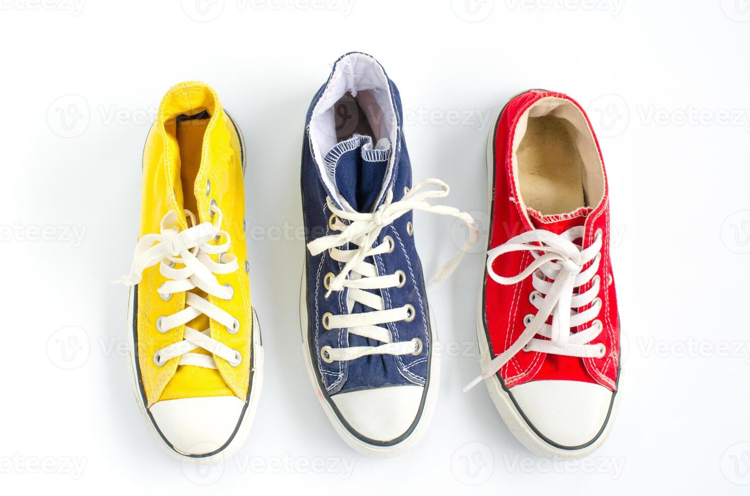 Multicolored sneakers on white background photo