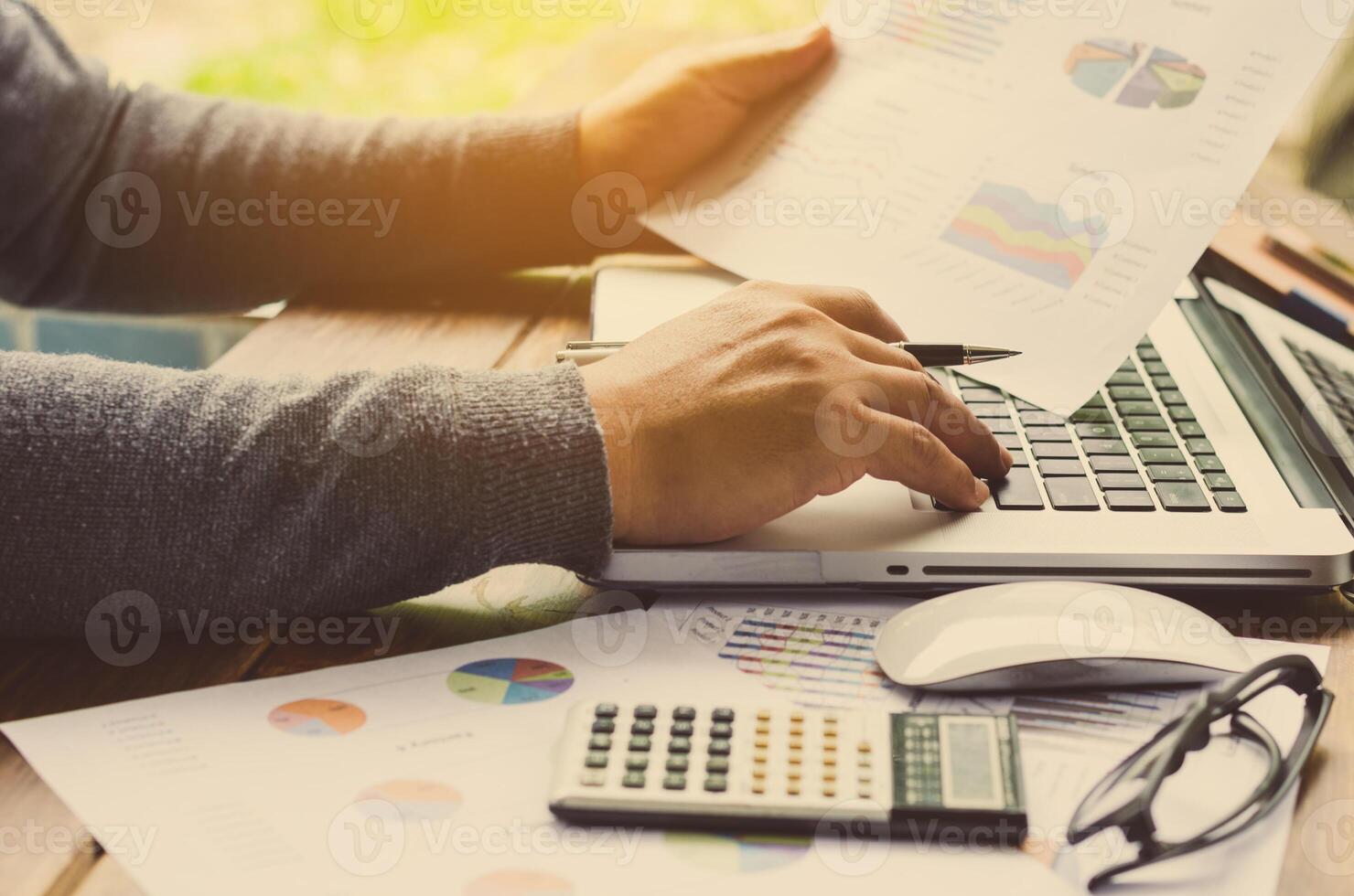 Working on a desk numerical analysis, financial accounting. Graphing photo