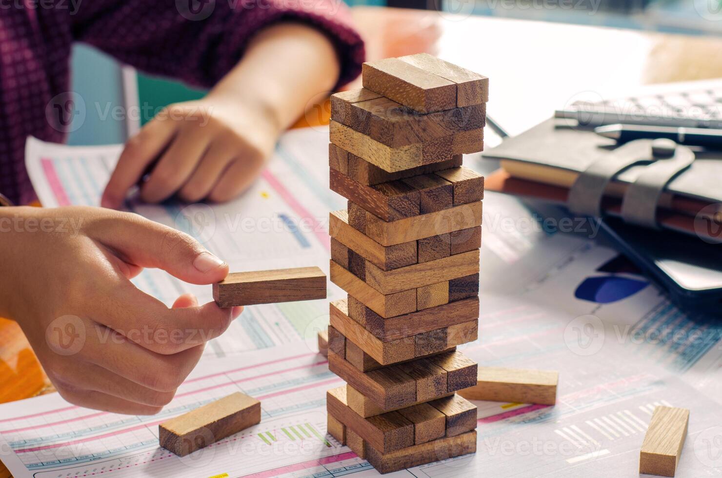 Business risks in the business. Requires planning Meditation must be careful in deciding to reduce the risk in the business. As the game drew to a wooden block from the tower photo