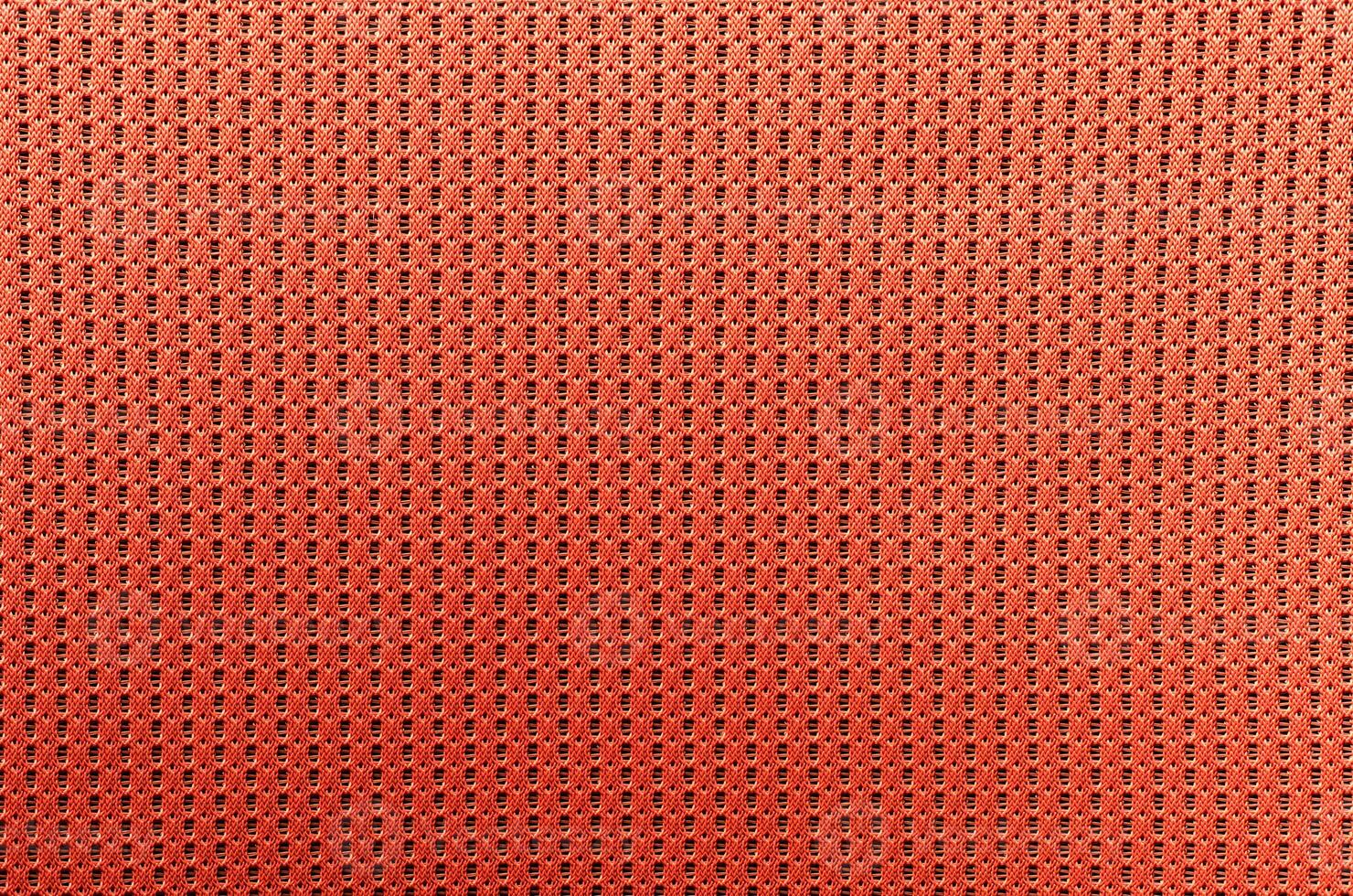 fabric orange colored background with light penetrating through photo