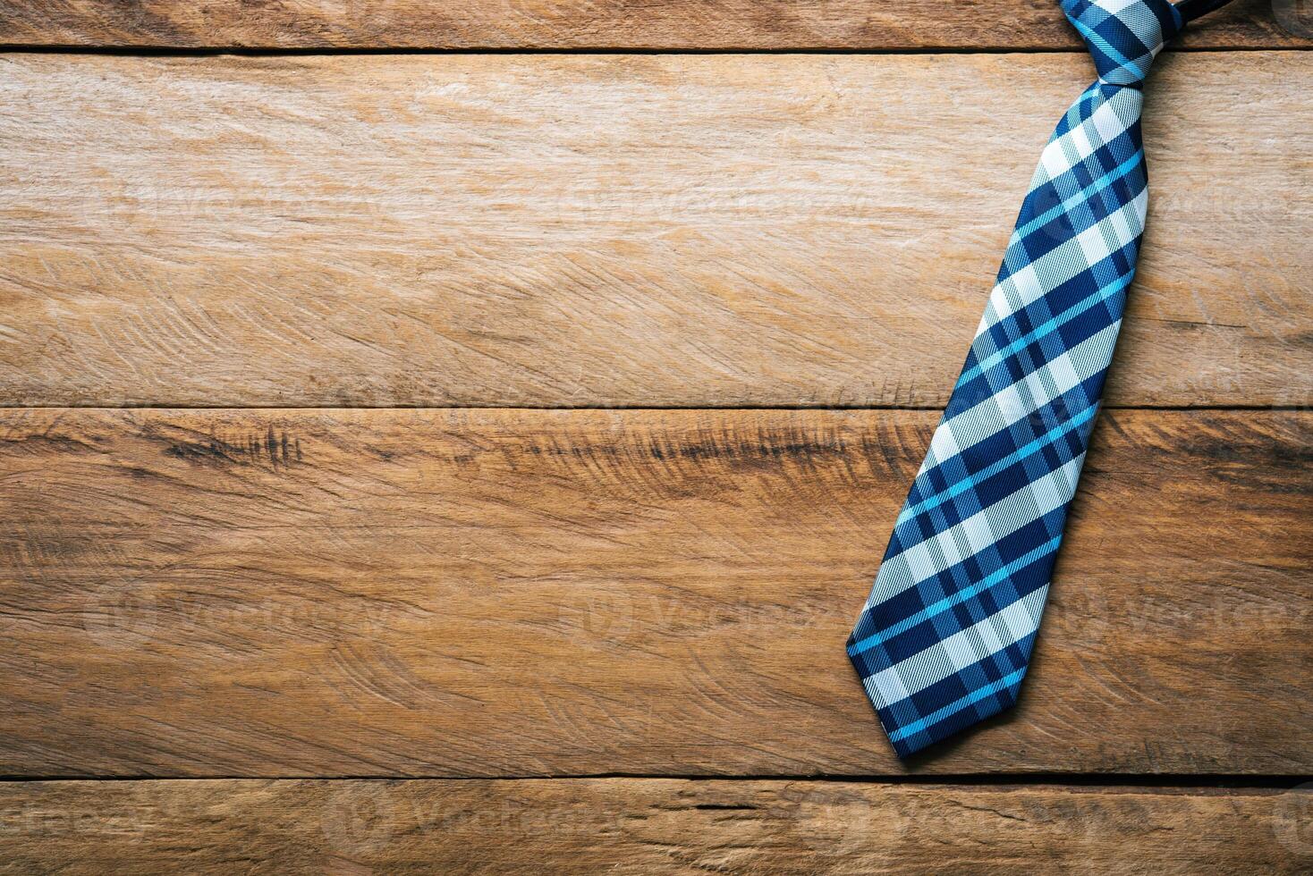 Father's Day Gift Ideas - Neckties and gift boxes are placed on wooden floor. photo