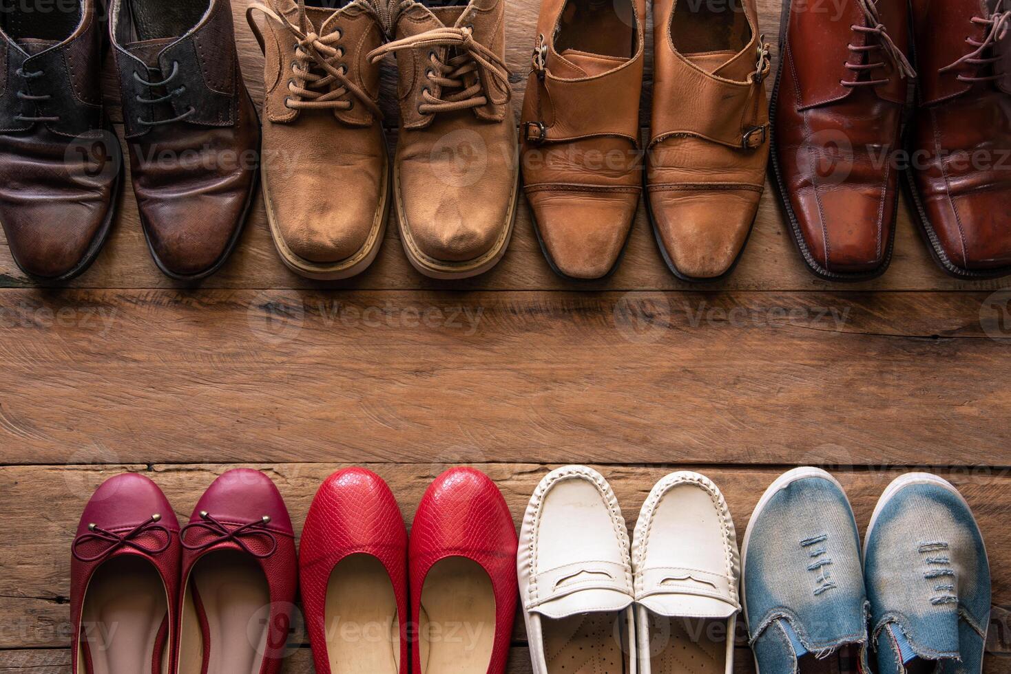 shoes with men and women various styles on a wooden floor - lifestyles. photo