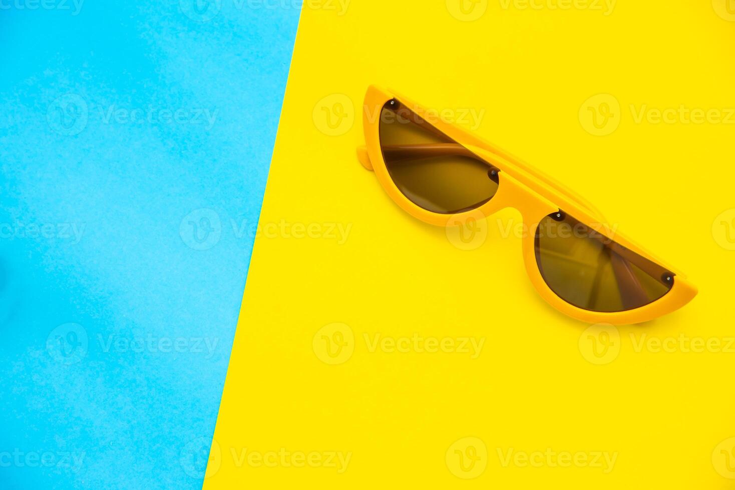 Top view for sunglasses on a colorful background. photo