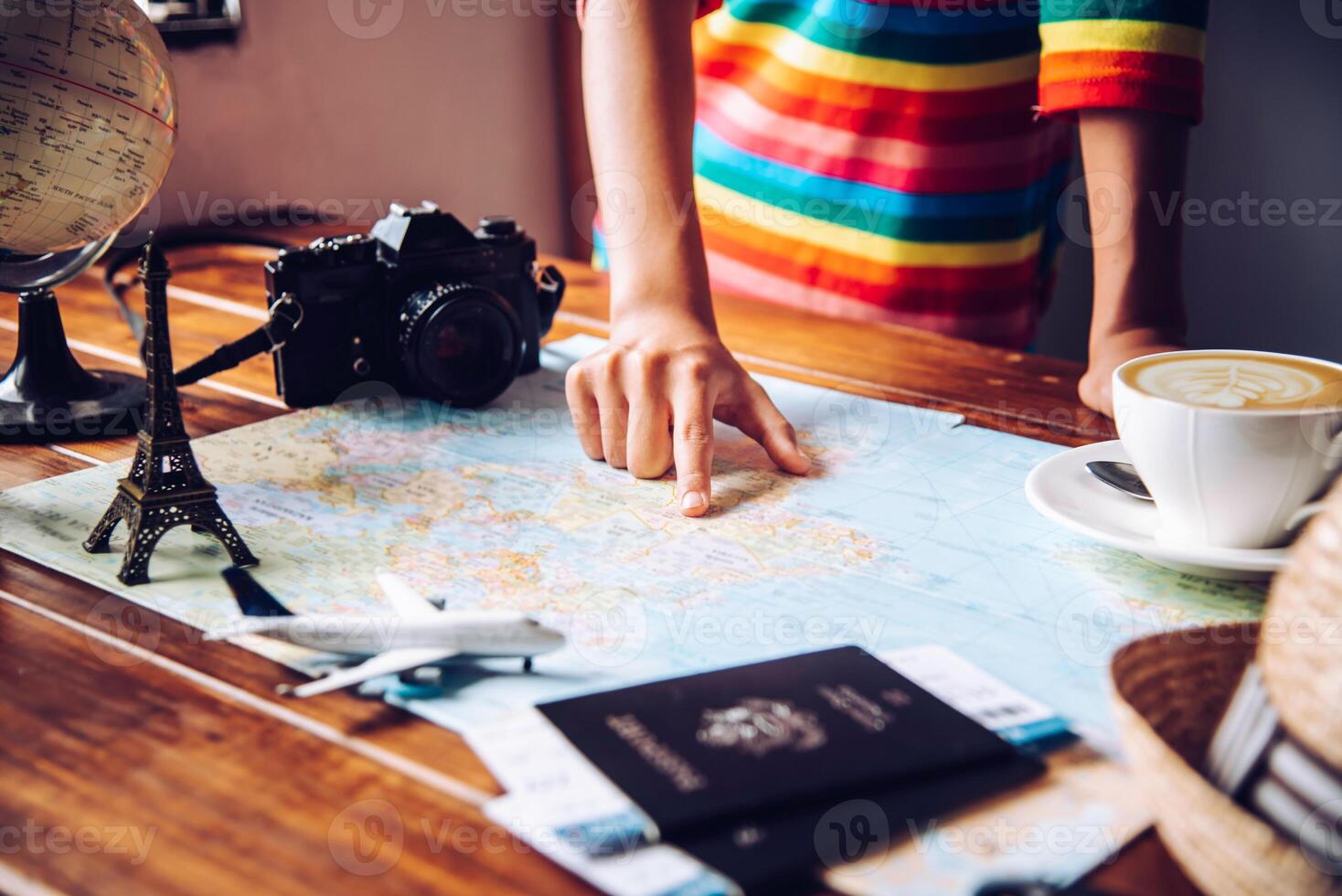 Travelers are planning a trip by searching the route on the map and searching for information on the internet. photo