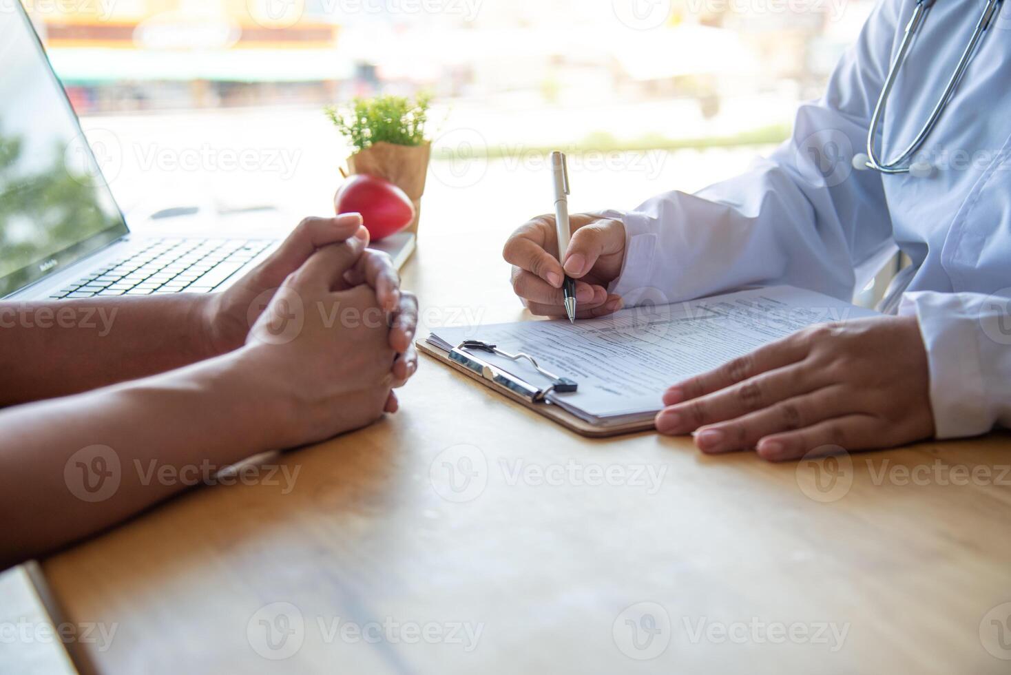 The doctor is discussing with the patient after a physical examination of the results and treatment guidelines. photo