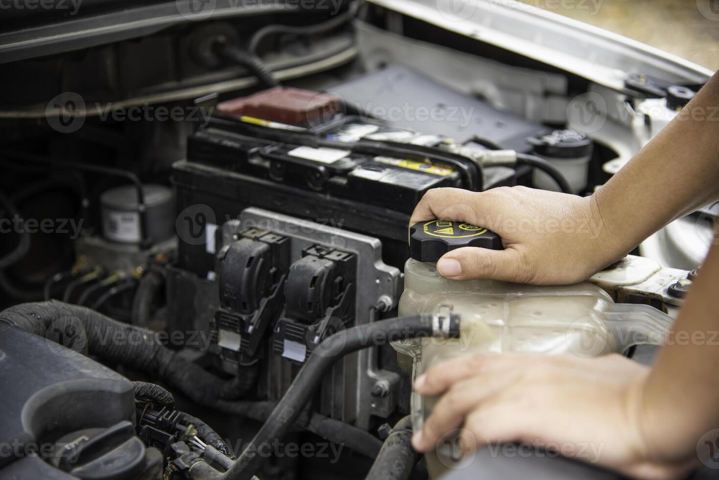 Professional mechanic is checking for engine malfunction photo