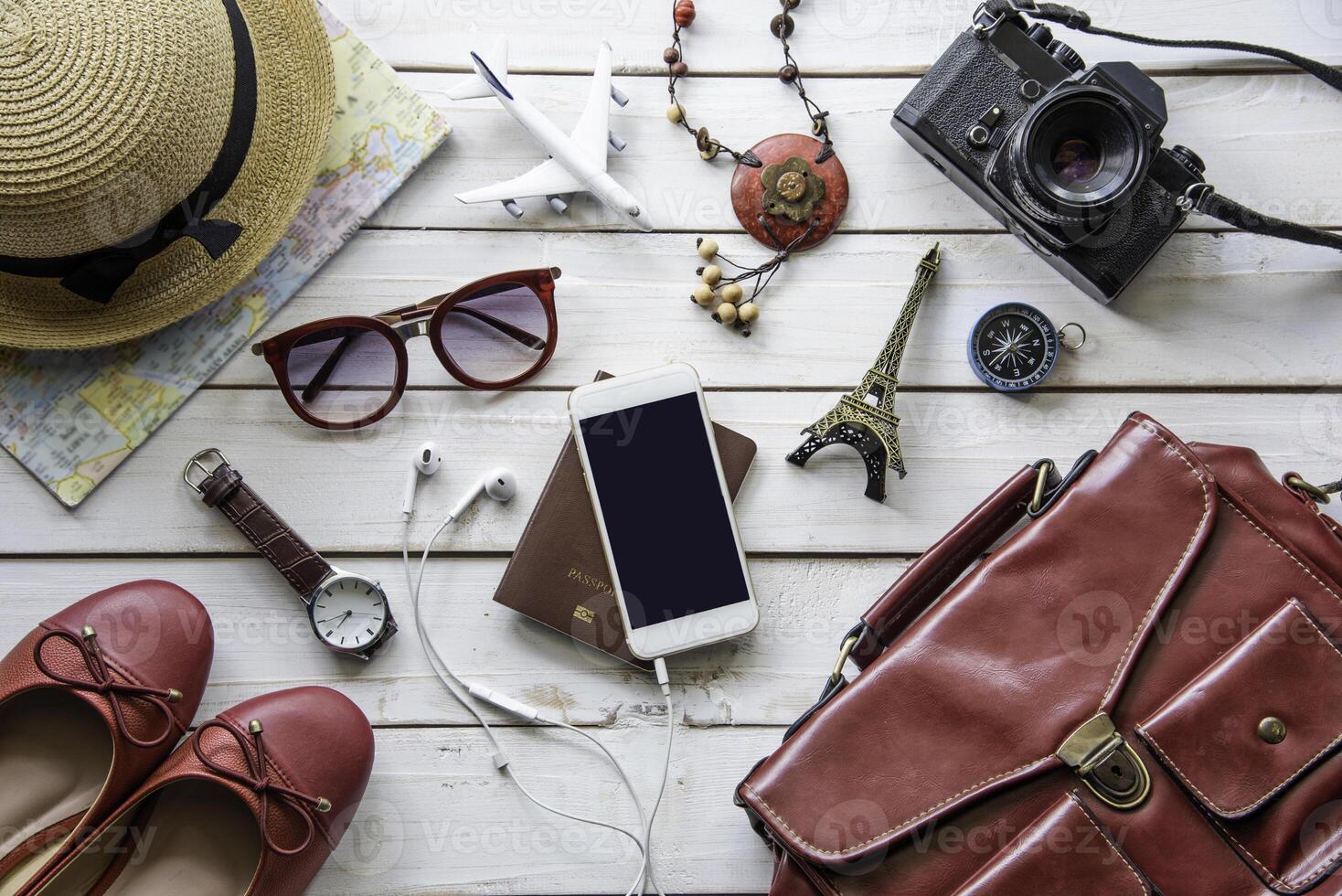 Travel accessories and costume on wooden floor photo