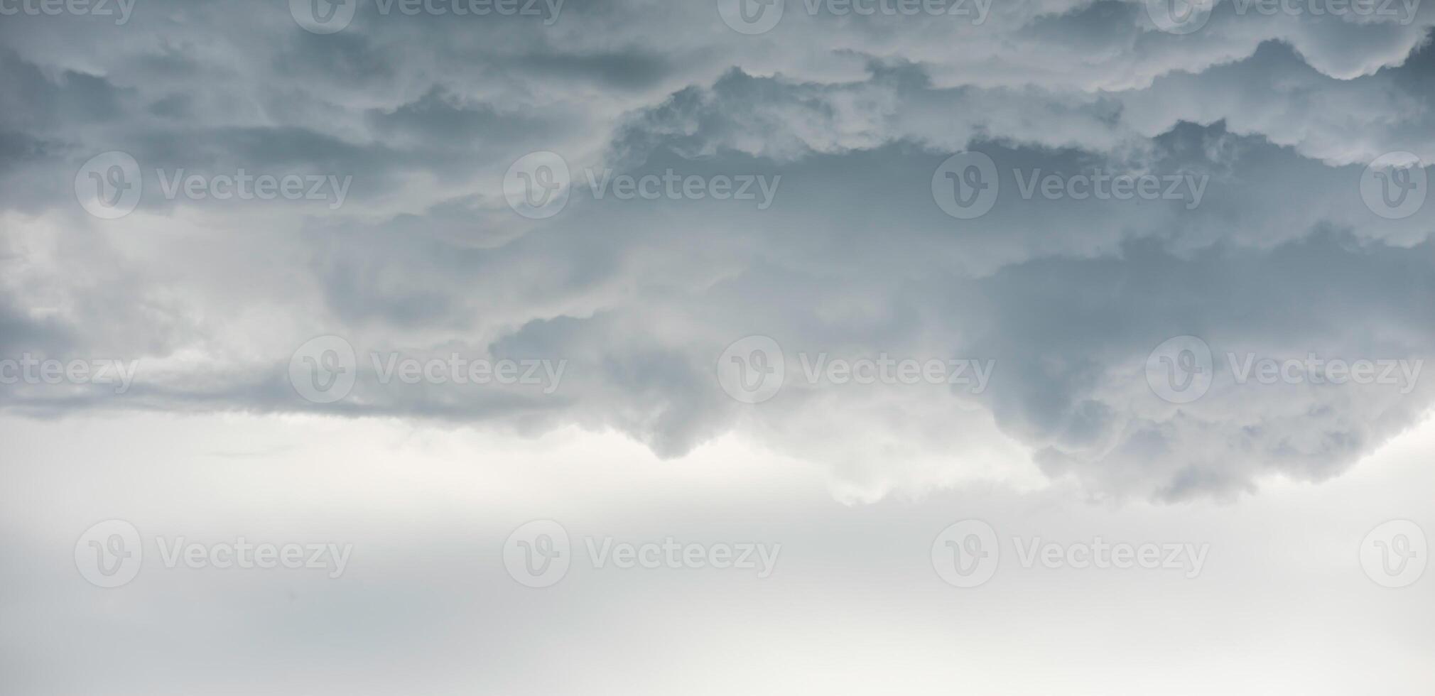 Rain clouds background.Clouds become dark gray like a big smoke before rainfall photo