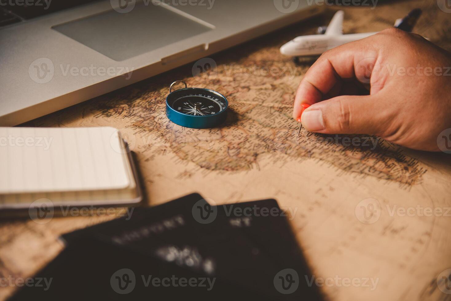 Travelers are planning a trip by searching the route on the map and searching for information on the internet. photo