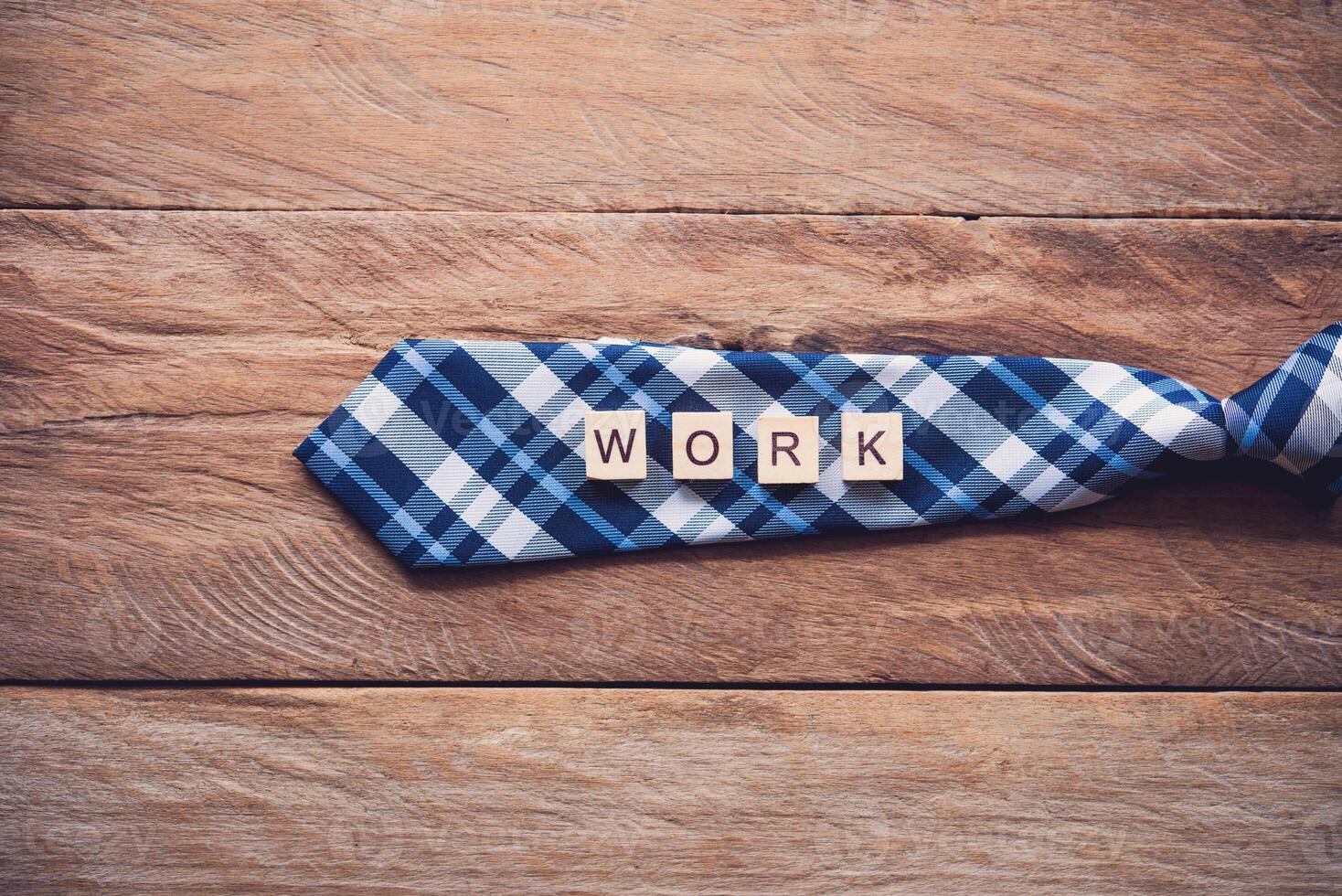 Necktie and the message  work  put on wooden floor - Concept of lifestyle for businessman. photo