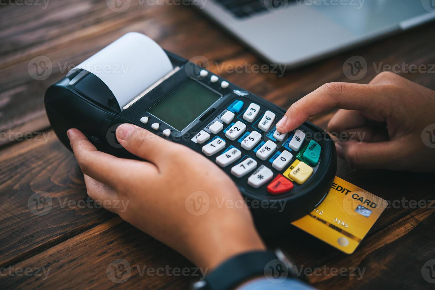 Paying by credit card , buying and selling products using a credit card swipe machine photo