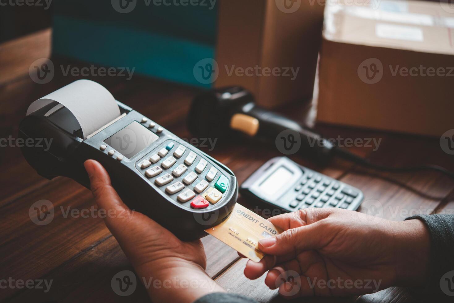 Paying by credit card , buying and selling products using a credit card swipe machine photo