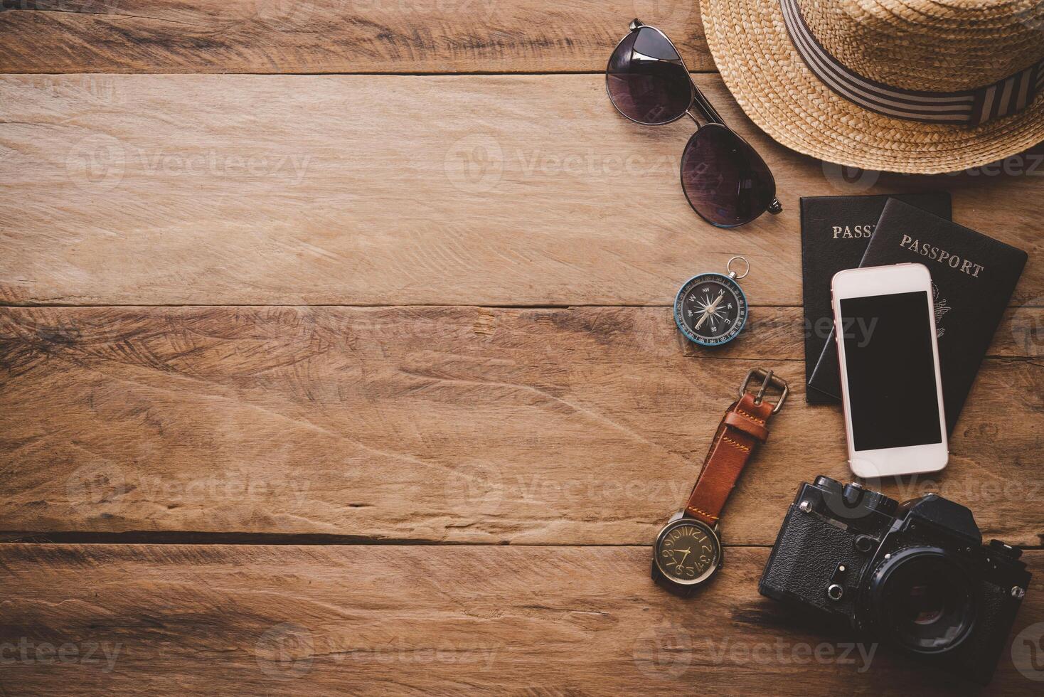 Travel accessories on wooden floor ready for travel photo