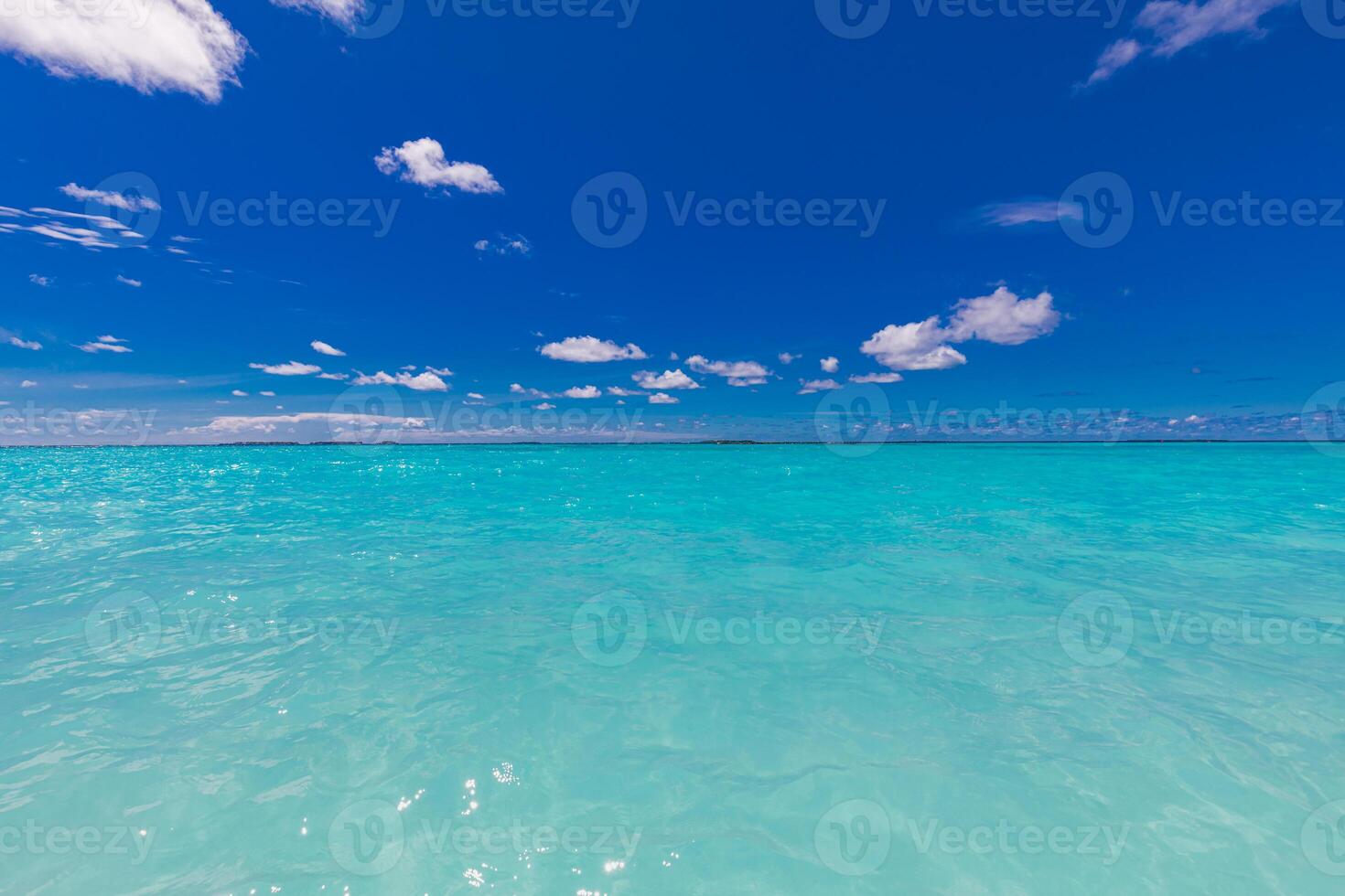 Crystal clear sea water bay. Pristine ocean lagoon sunny cloudy sky, idyllic relaxing seascape. Transparent surface, exotic travel. tropics Mediterranean nature panorama. Summer background, beach view photo