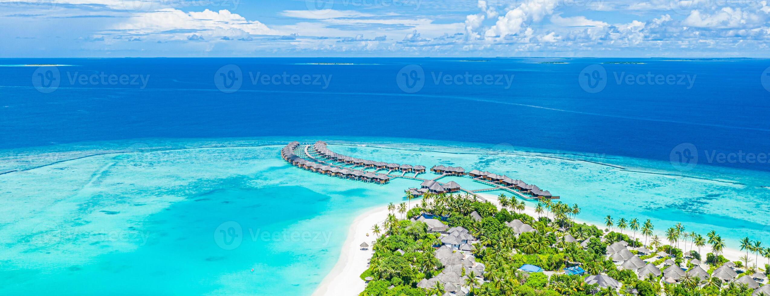 Beautiful Maldives paradise. Tropical aerial travel landscape, seascape with wooden bridge, water villas, amazing sea sand sky beach, tropical island nature. Exotic tourism destination summer vacation photo