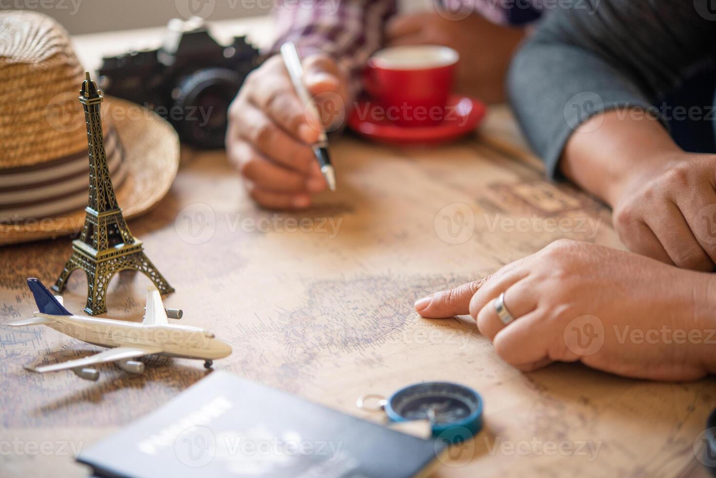 Travelers are planning a trip by searching the route on the map and searching for information on the internet. photo