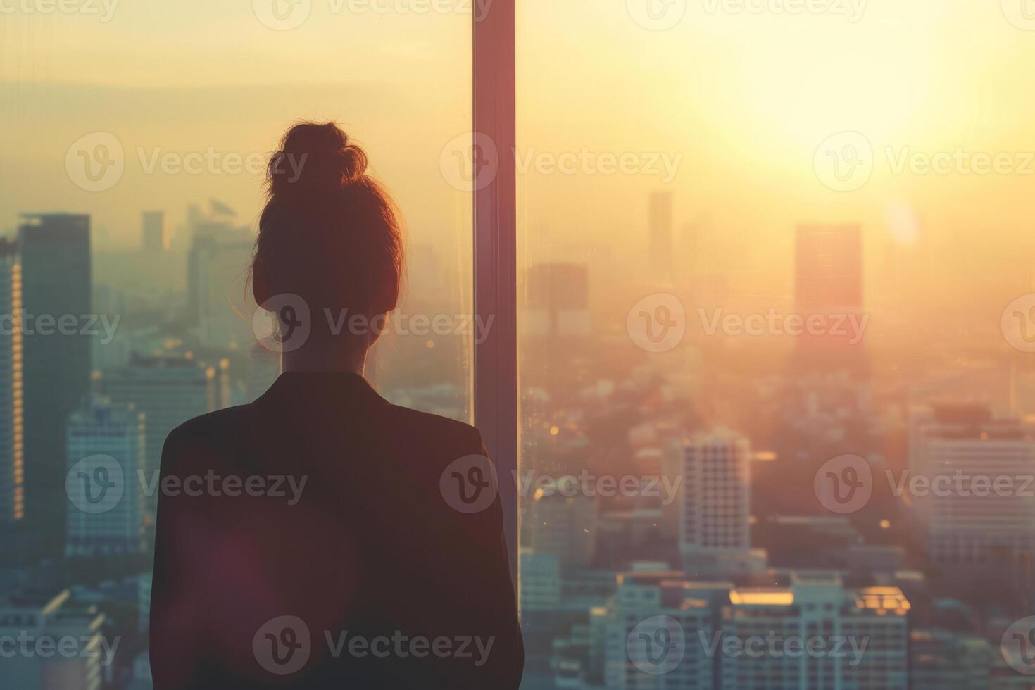 AI generated Back view of a a young businesswoman looks at a cityscape from an office window. Generative AI photo