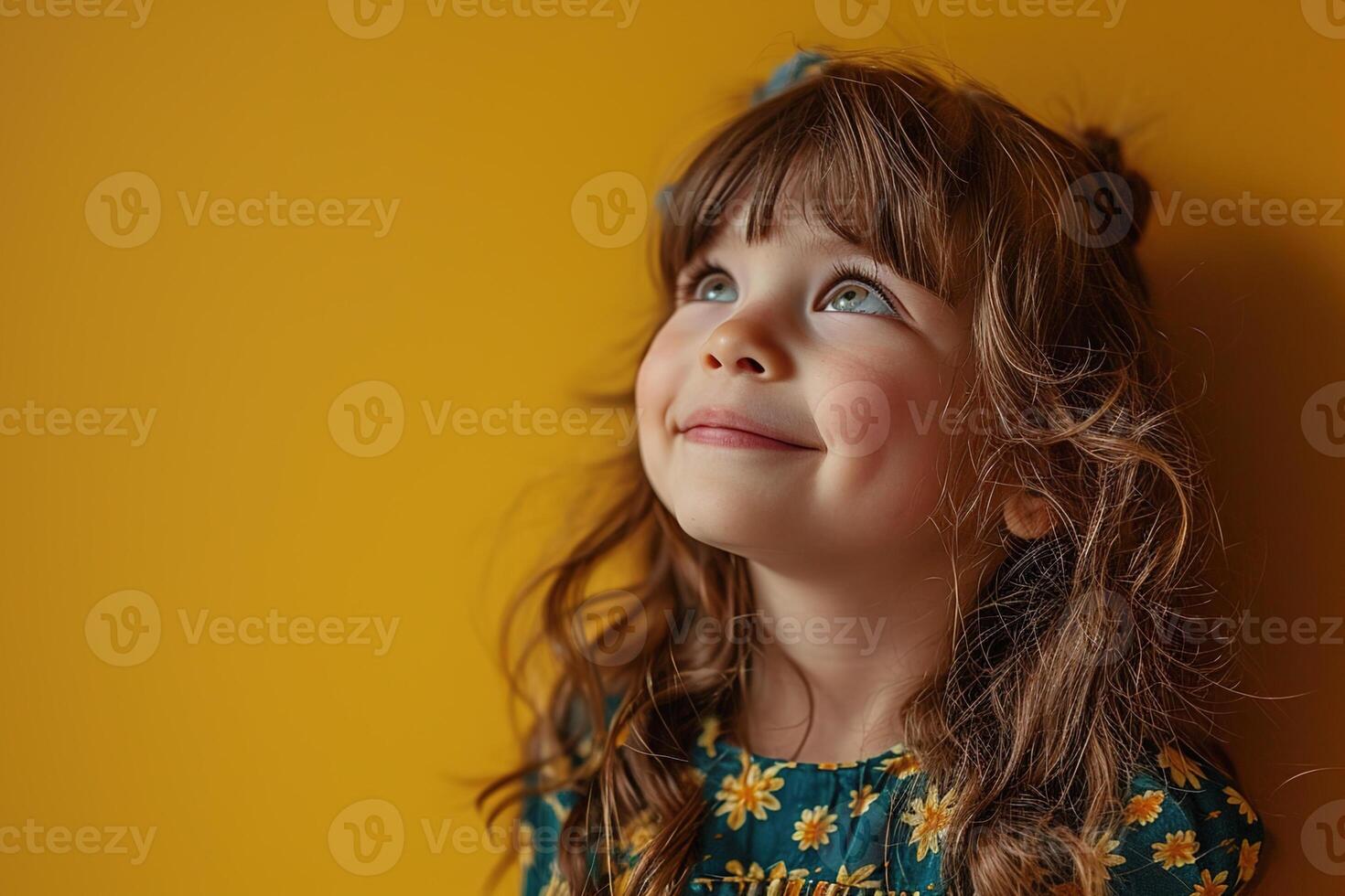 AI generated happy adorable little girl with curly hair looking away on yellow background, closeup smiling face photo