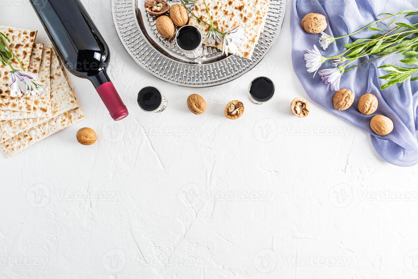 Concept of the Jewish holiday of Passover. Beautiful background with traditional holiday treats on white. A copy of the space. Flat layout. border. photo