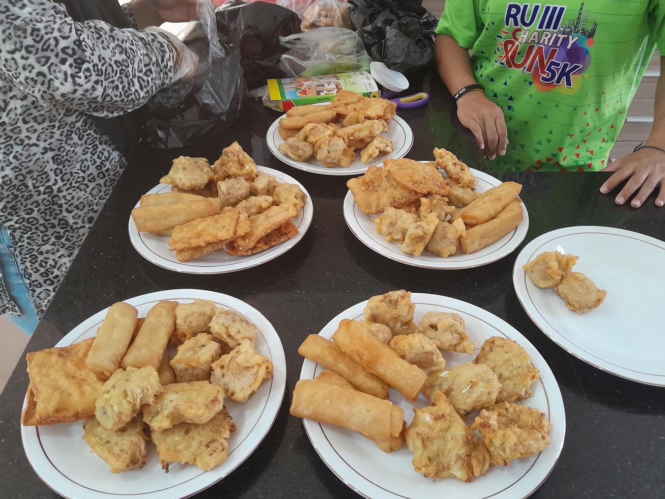 Fried food or Gorengan typical of Indonesia made from wheat, tempeh, vegetables. This photo is perfect for magazines, newspapers, cookbooks, advertisements, banners, posters.