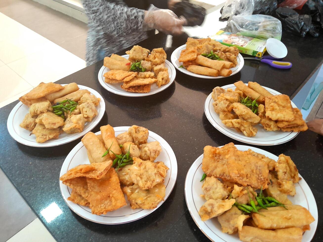 Fried food or Gorengan typical of Indonesia made from wheat, tempeh, vegetables. This photo is perfect for magazines, newspapers, cookbooks, advertisements, banners, posters