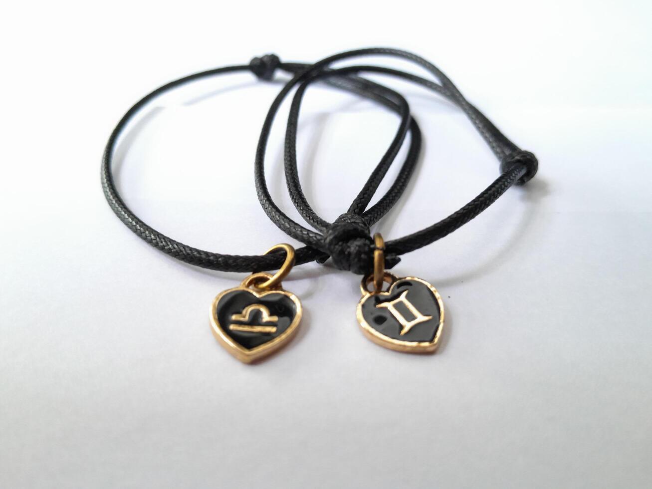Photo of bracelet with zodiac pendant. This photo is suitable for advertising photos, calendars, magazines, posters, banners