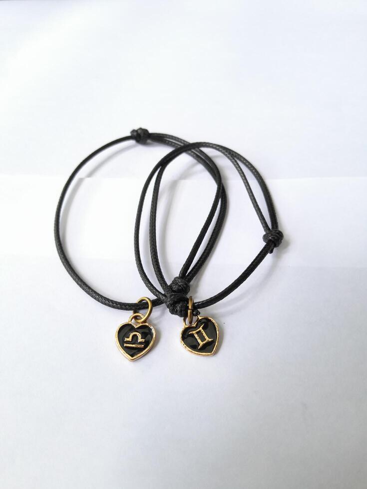 Photo of bracelet with zodiac pendant. This photo is suitable for advertising photos, calendars, magazines, posters, banners