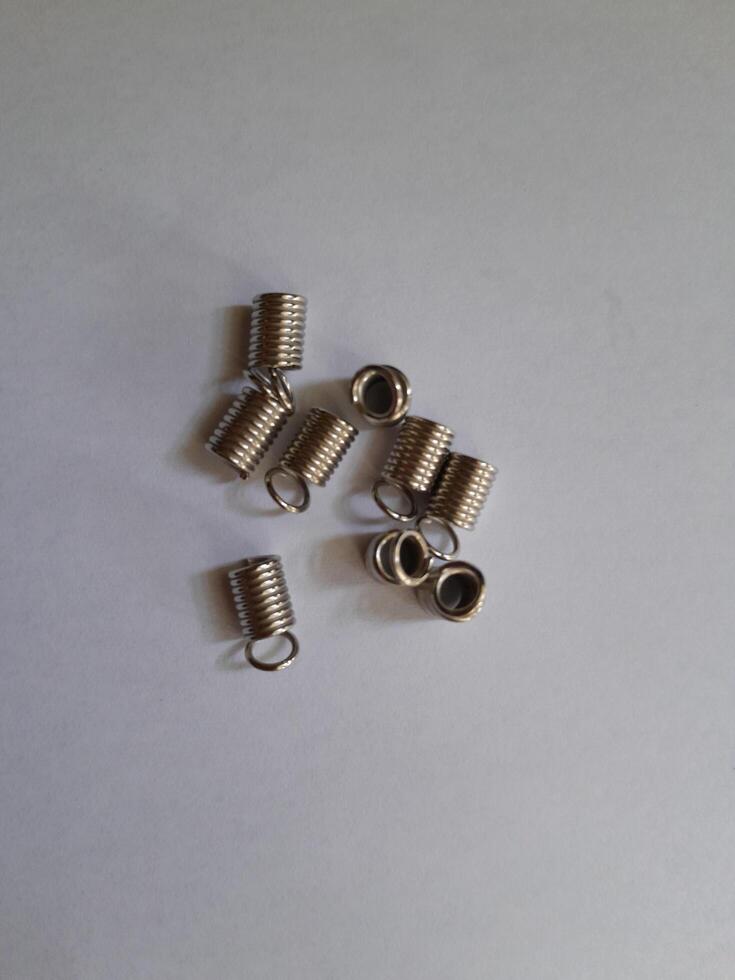 Steel spring on a white background. This photo is perfect for magazines, advertisements, posters, banners