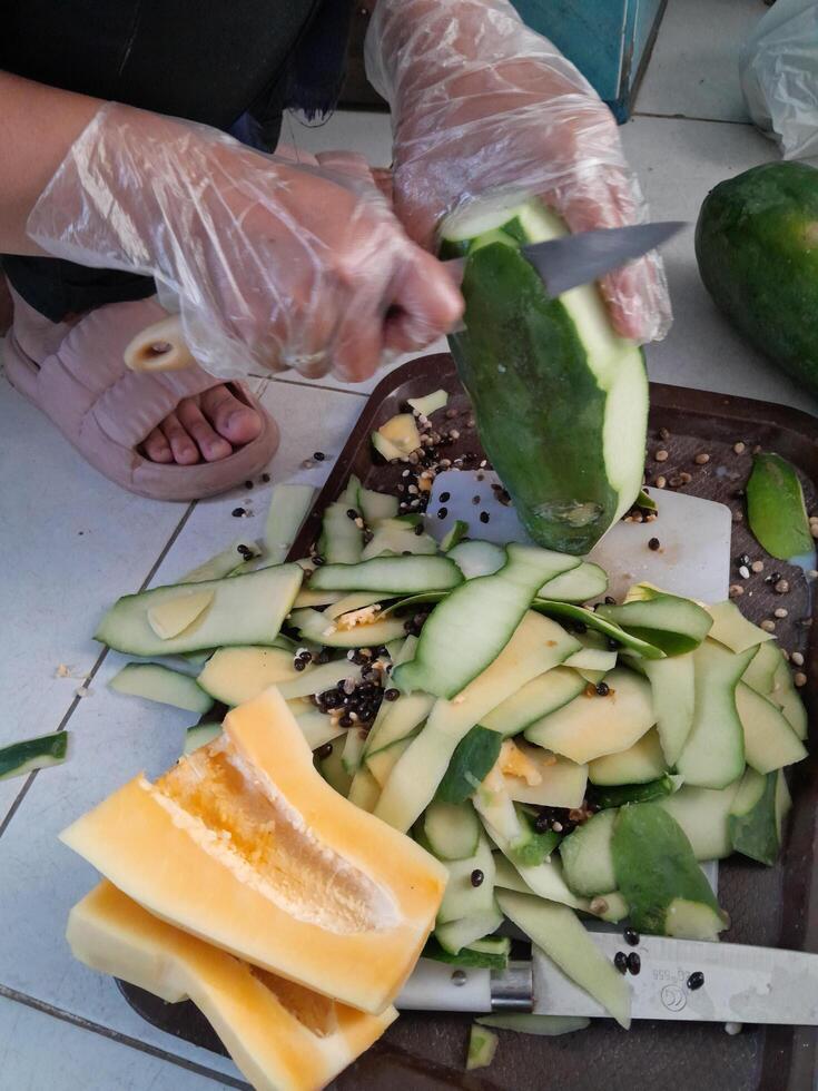 A photo of a papaya being peeled. Perfect for newspapers, magazines and tabloids