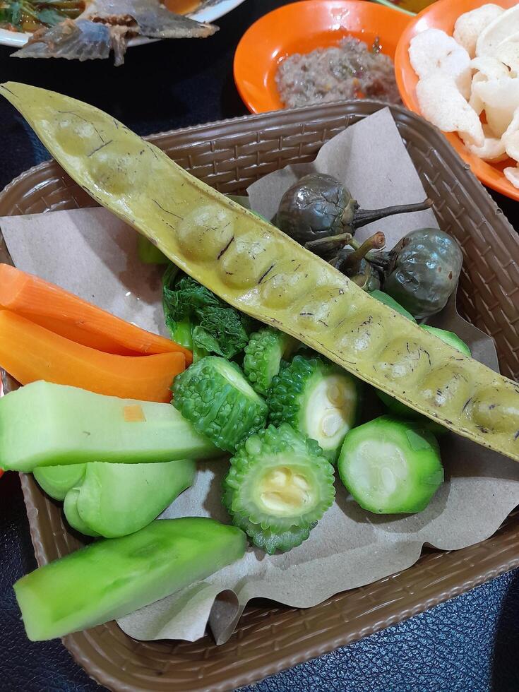 A photo of a stew or lalap consisting of petai, wrotel, aubergine and pumpkin. Perfect for magazines, newspapers, adverts and tabloids