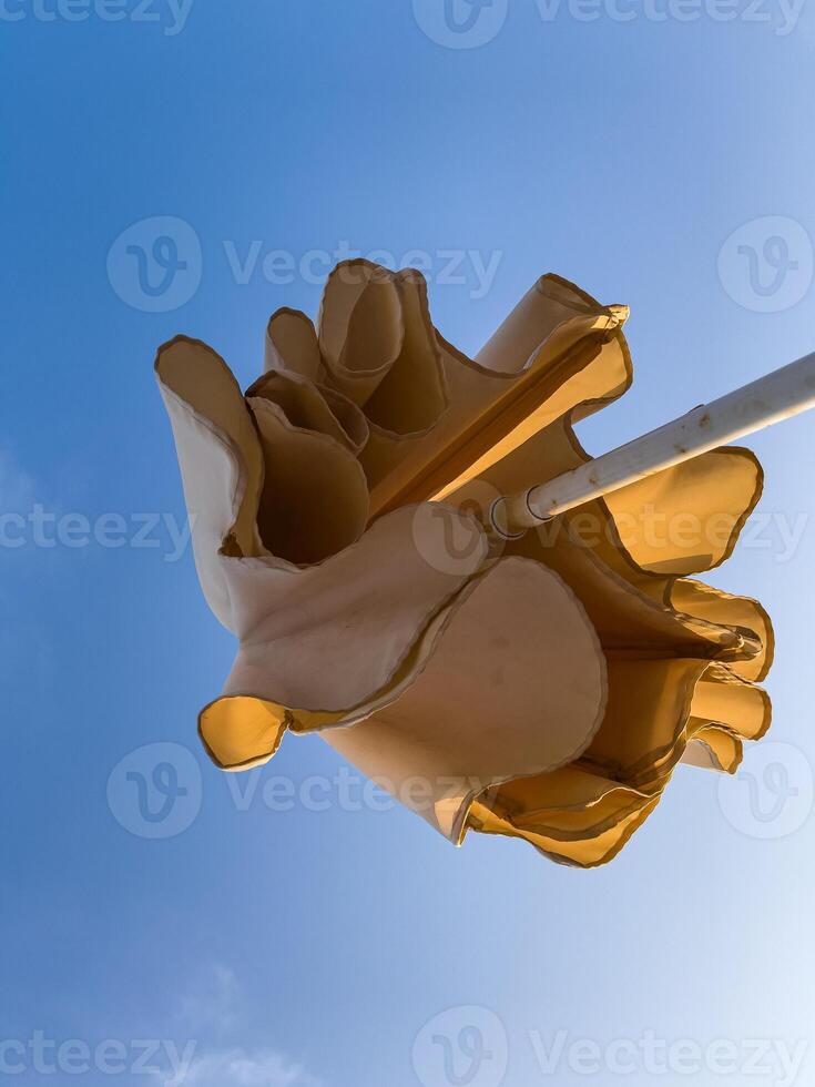 Beach umbrella under the blue sky in summer photo