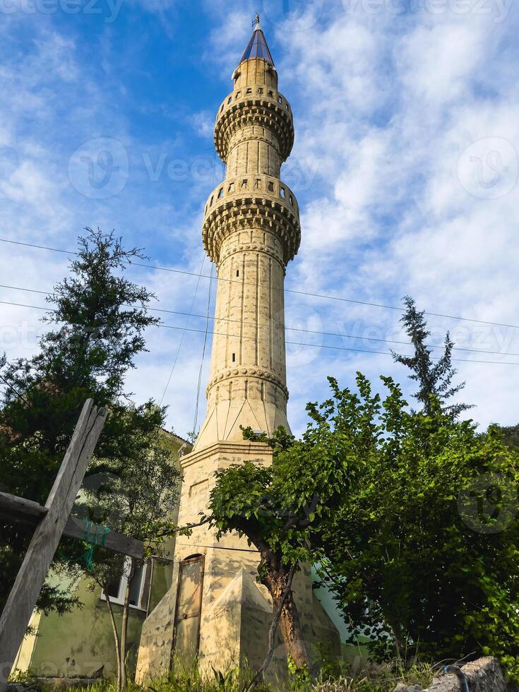 Mosque tower in a village photo