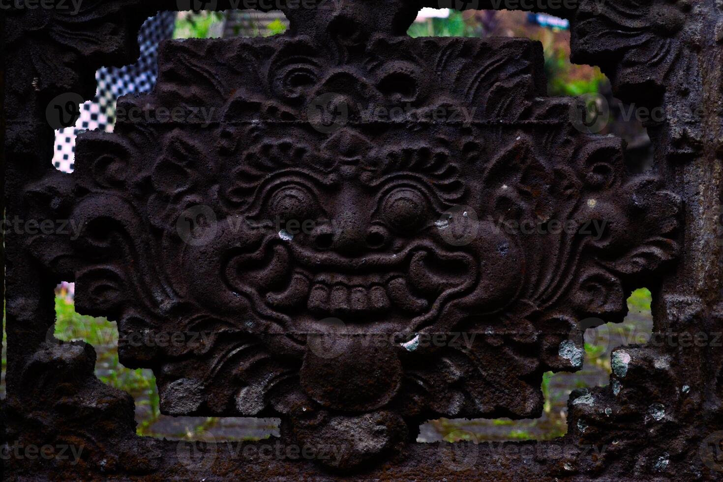 a decorative stone carving on a fence photo