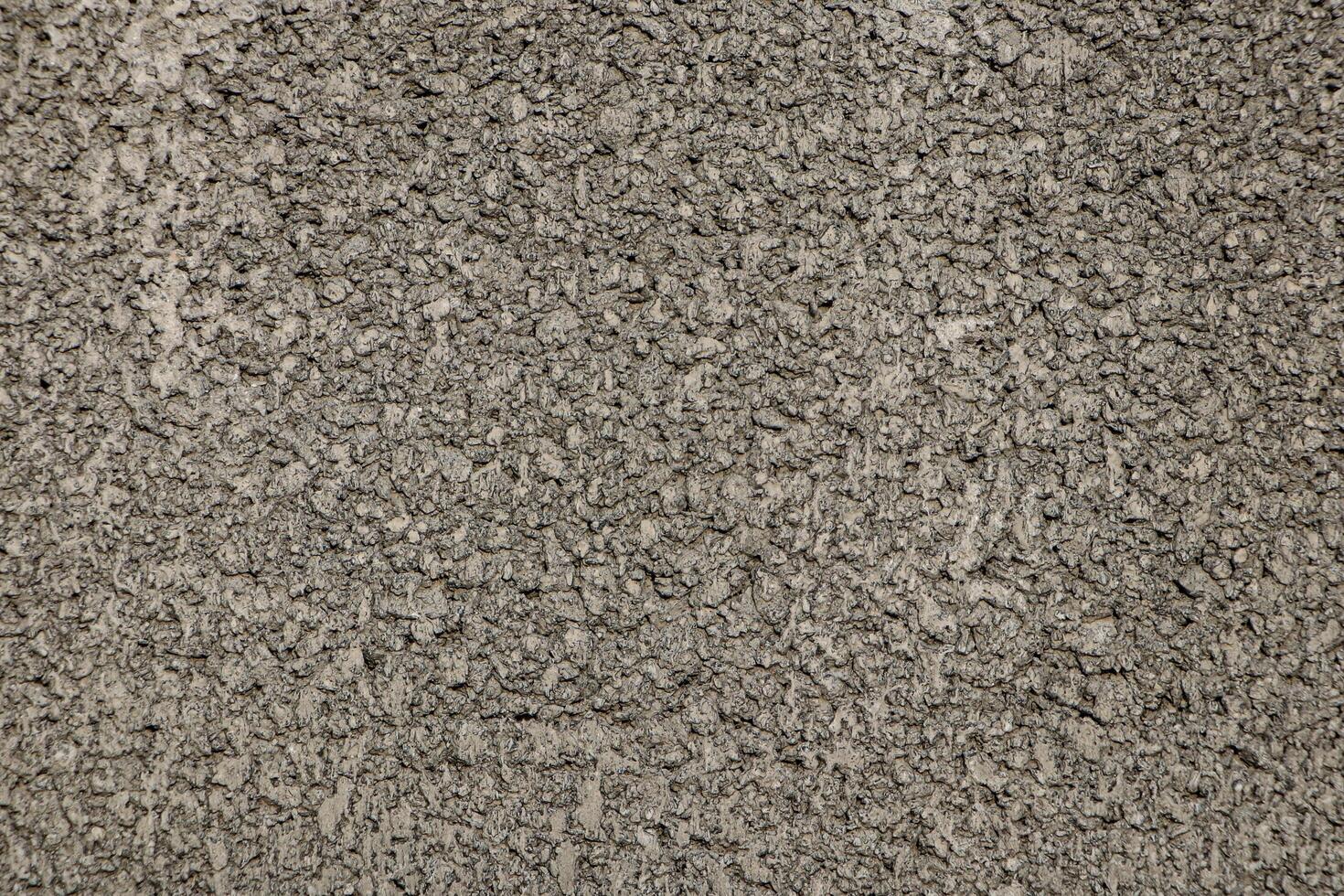 Close-up shot of cement wall with rough surface photo