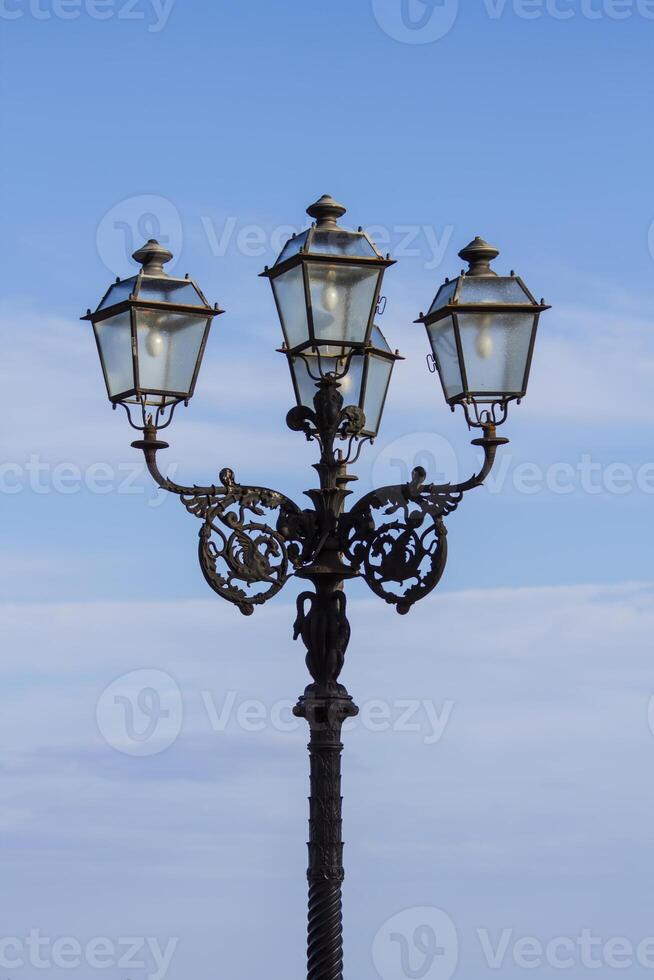 Street chandelier under blue sky photo