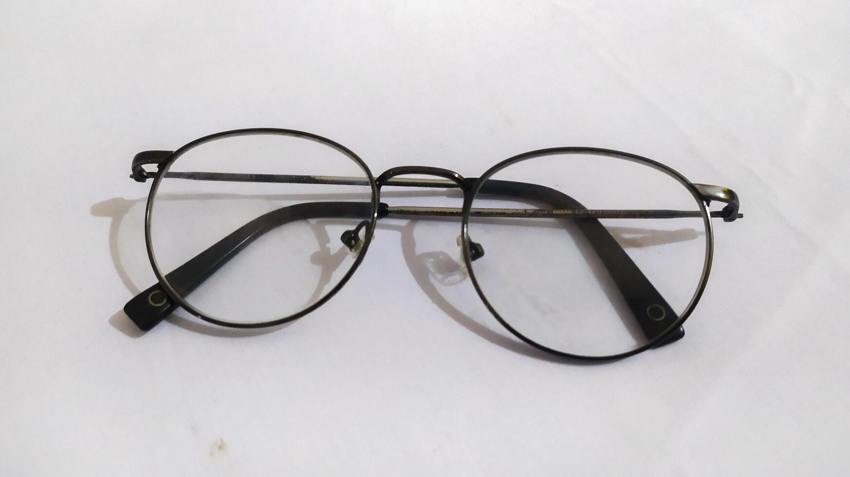 a pair of glasses photographed on a white background photo