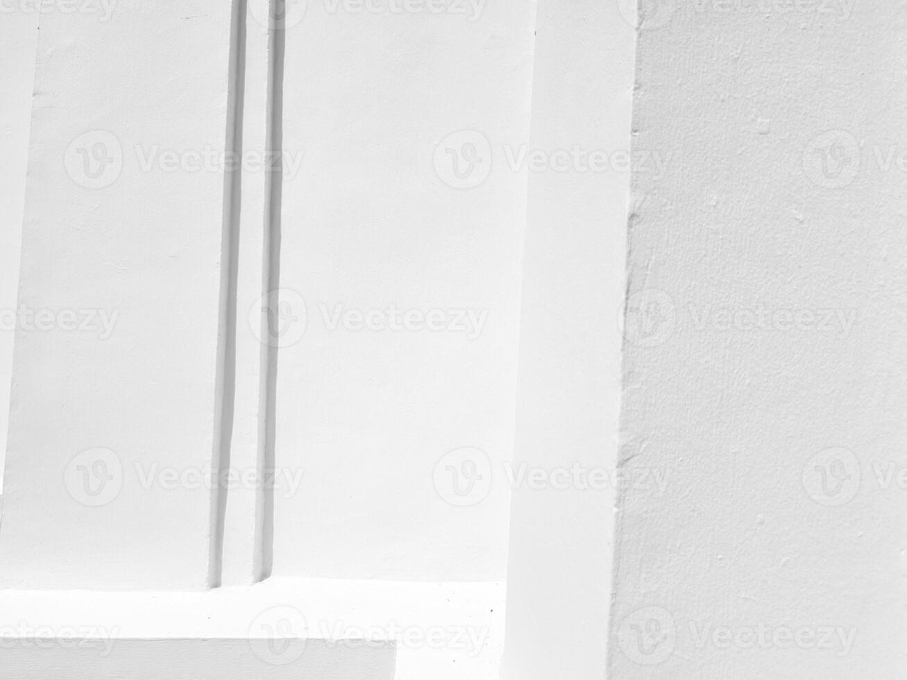 White Stucco Wall with Natural Light and Shadow Background. photo