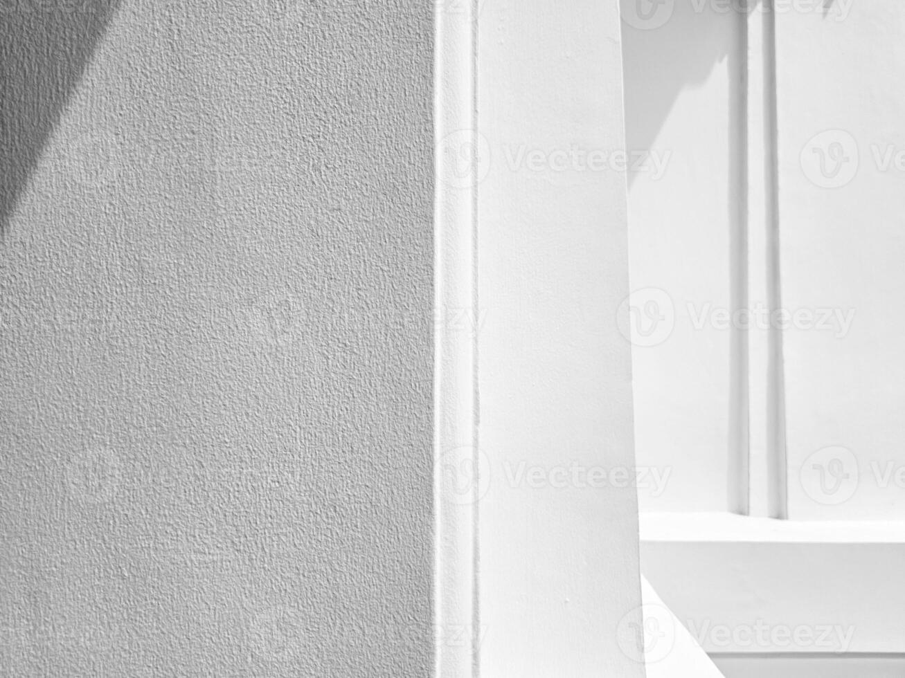 White Stucco Wall with Natural Light and Shadow Background. photo