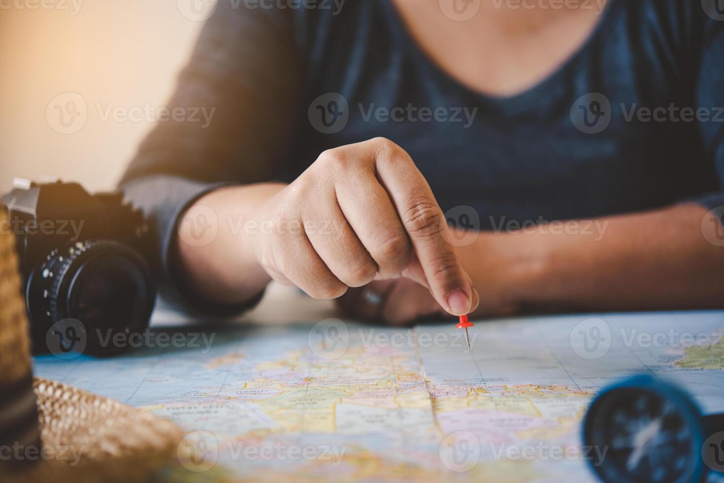 Travelers are planning a trip by searching the route on the map and searching for information on the internet. photo