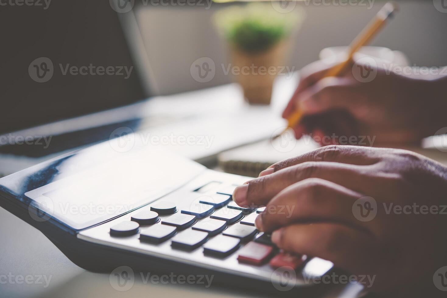 Businessman are working with a calculator and document. Meeting report in progress. in office business concept photo
