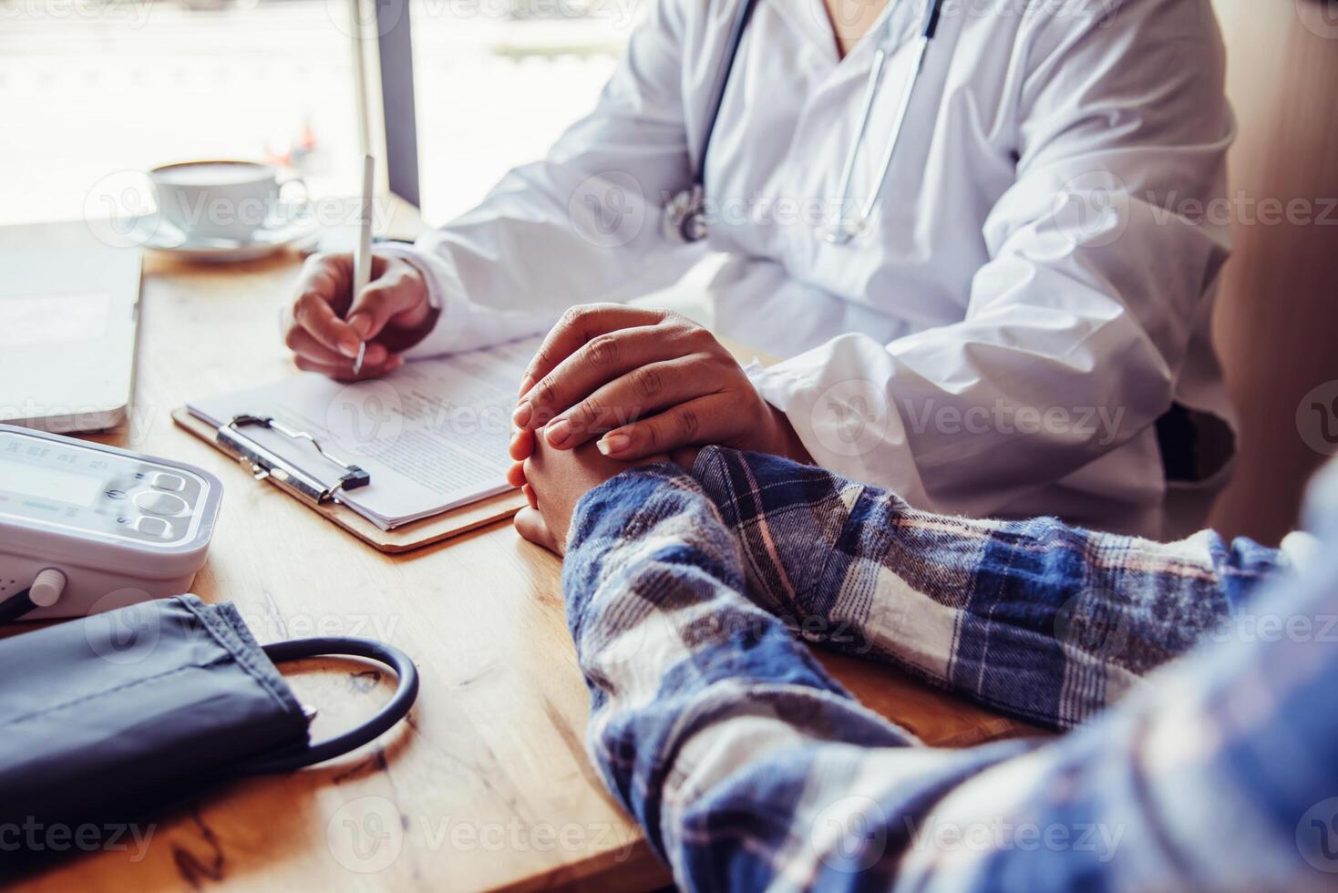 The doctor is discussing with the patient after a physical examination of the results and treatment guidelines. photo