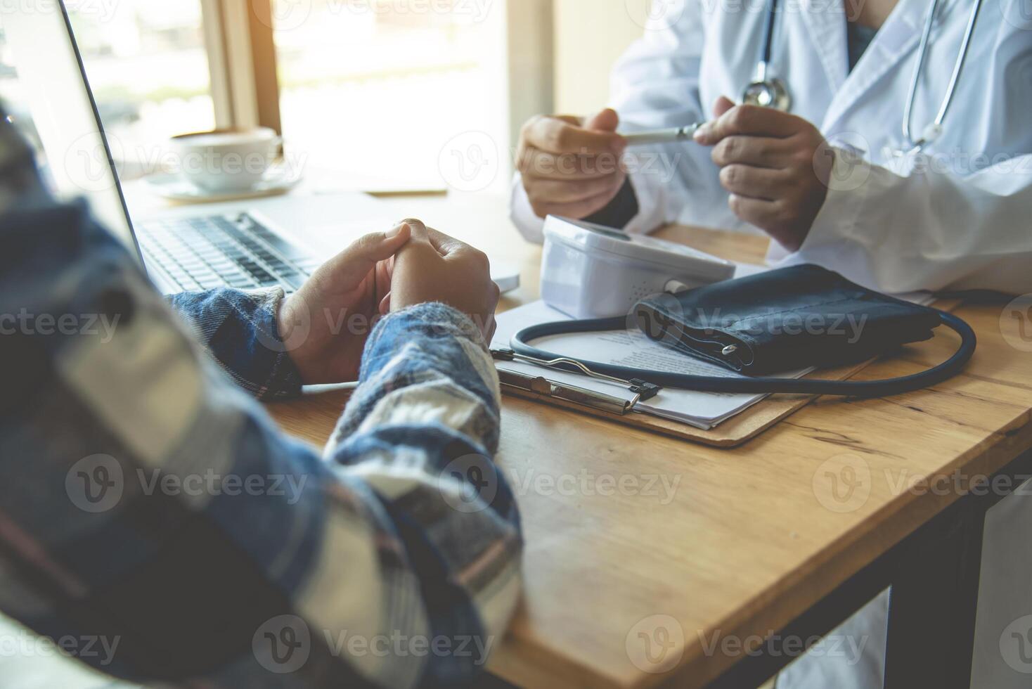 The doctor is discussing with the patient after a physical examination of the results and treatment guidelines. photo