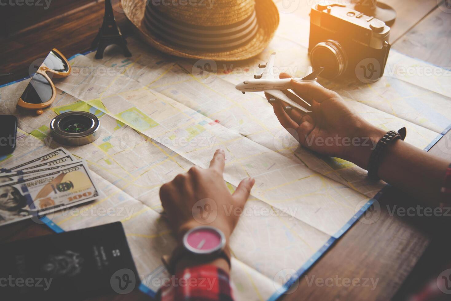 Travelers are planning a trip by searching the route on the map and searching for information on the internet. photo