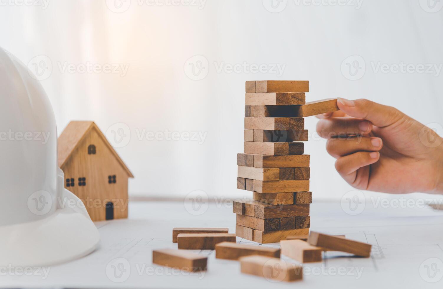 Business risks in the business. Requires planning Meditation must be careful in deciding to reduce the risk in the business. As the game drew to a wooden block from the tower photo