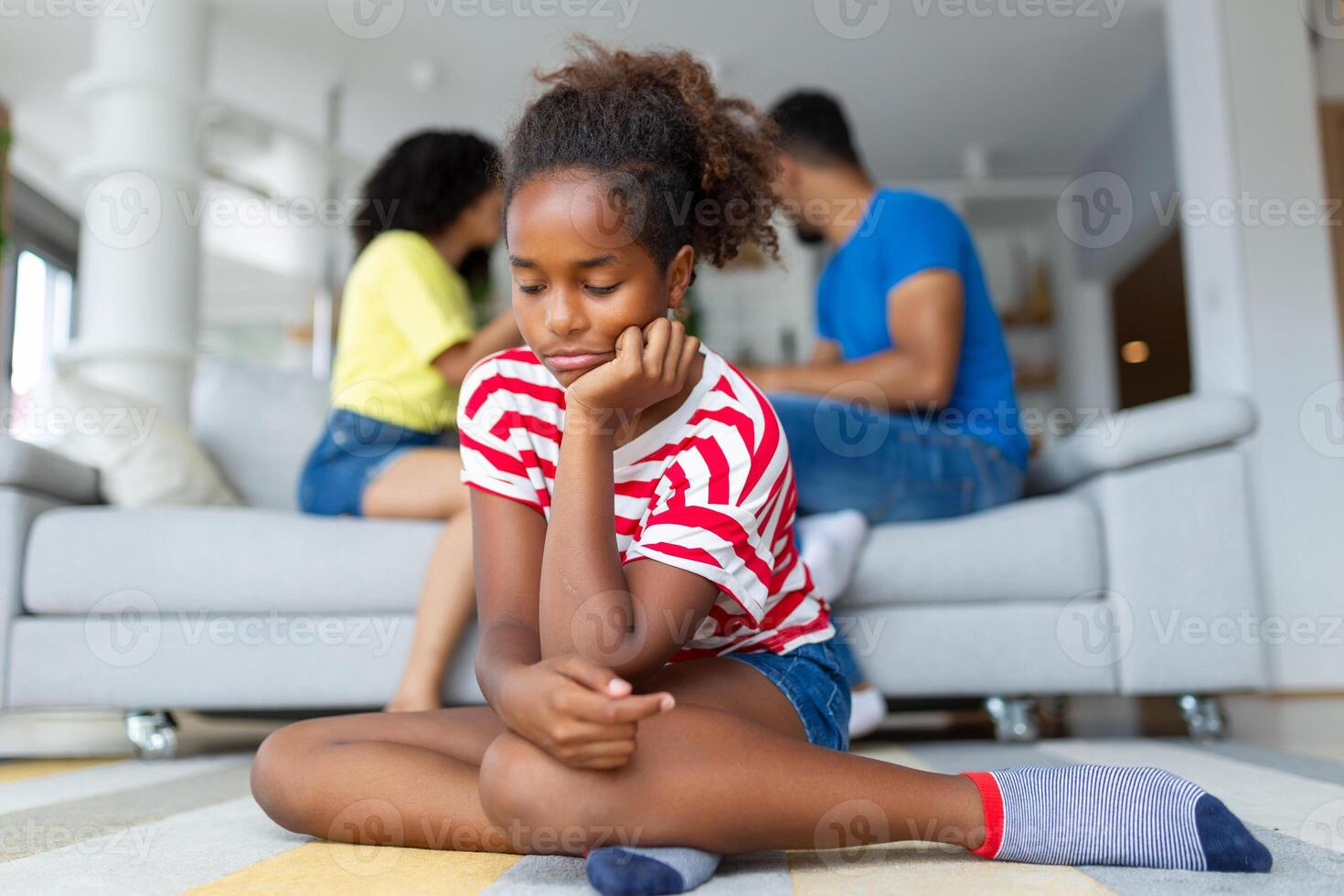 Upset african kid by parents fighting arguing at home, sad stressed little innocent girl suffer from family problems conflicts, unhappy mom dad shouting quarreling divorcing photo