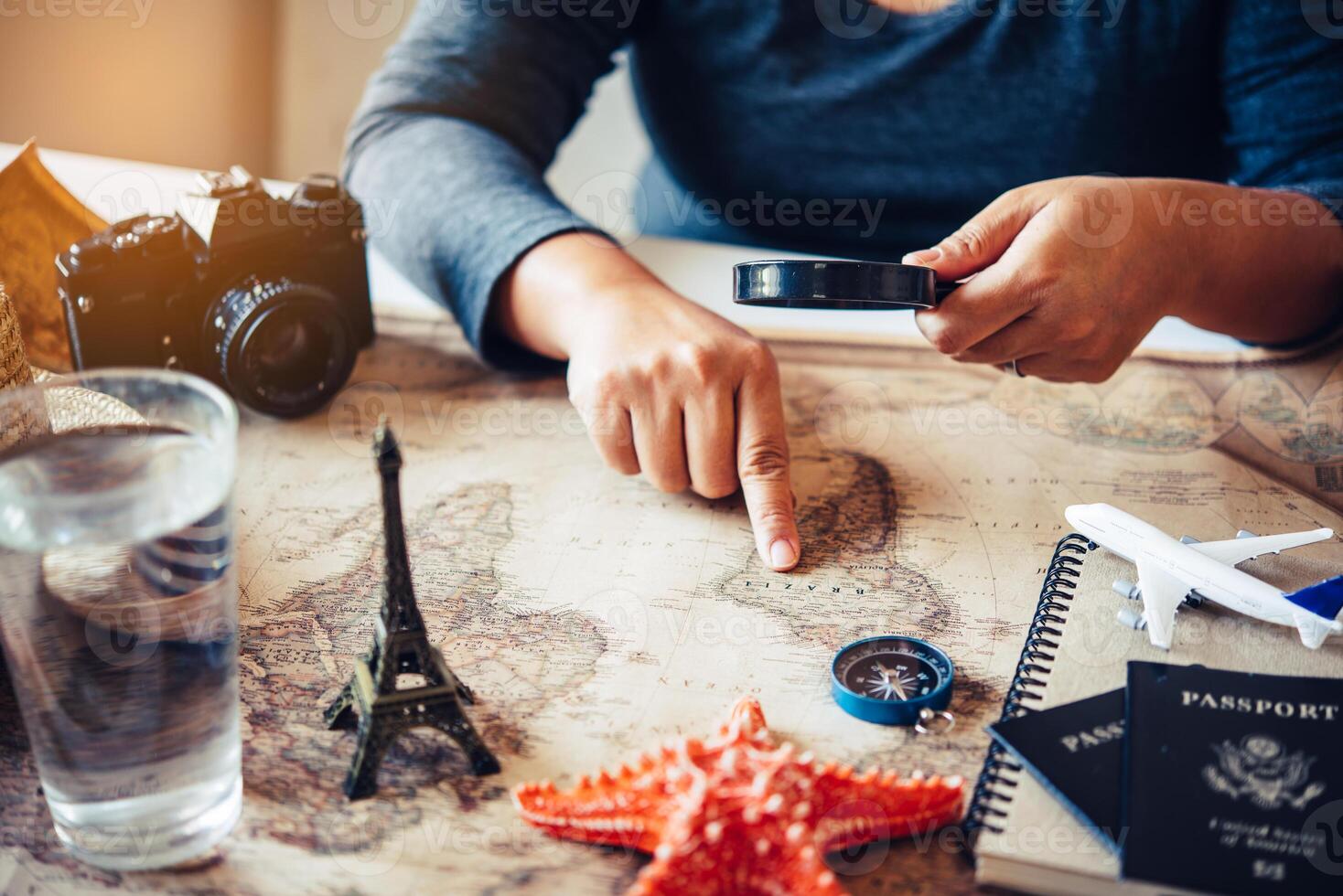 Travelers are planning a trip by searching the route on the map and searching for information on the internet. photo